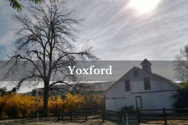 A picturesque view of Yoxford village with historic buildings and lush greenery.